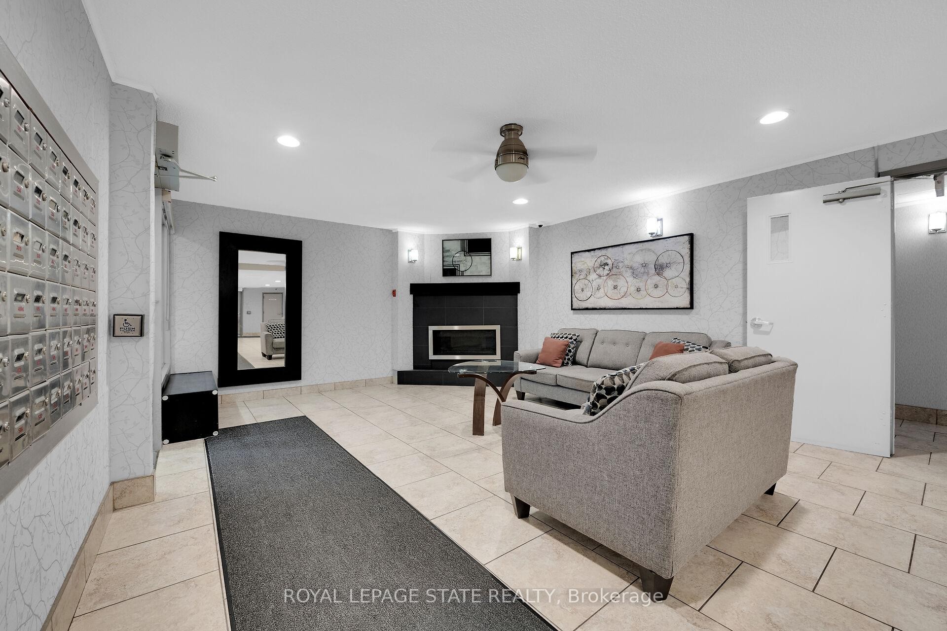 220-198 Scott Street, St. Catharines, ON - Indoor With Fireplace