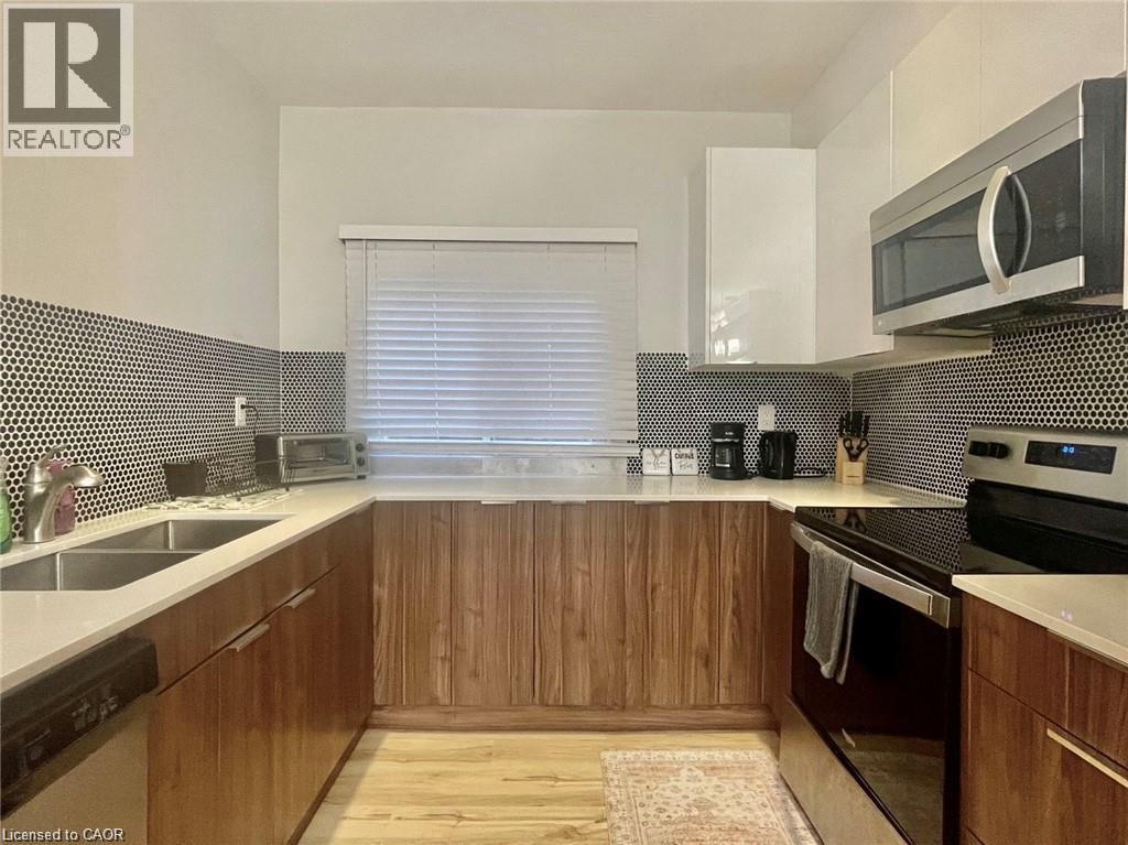 25 Krug Street Unit# 1, Kitchener, ON - Indoor Photo Showing Kitchen With Stainless Steel Kitchen With Double Sink With Upgraded Kitchen