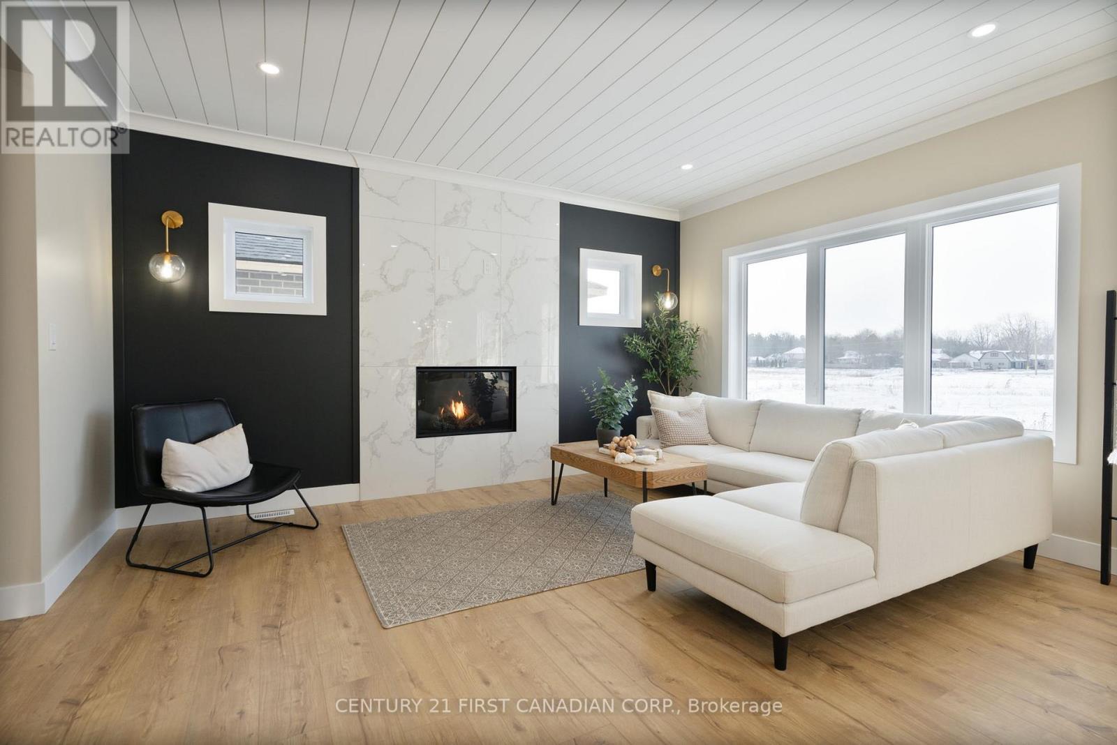25 Sheldabren Street, North Middlesex (Ailsa Craig), ON - Indoor Photo Showing Living Room With Fireplace