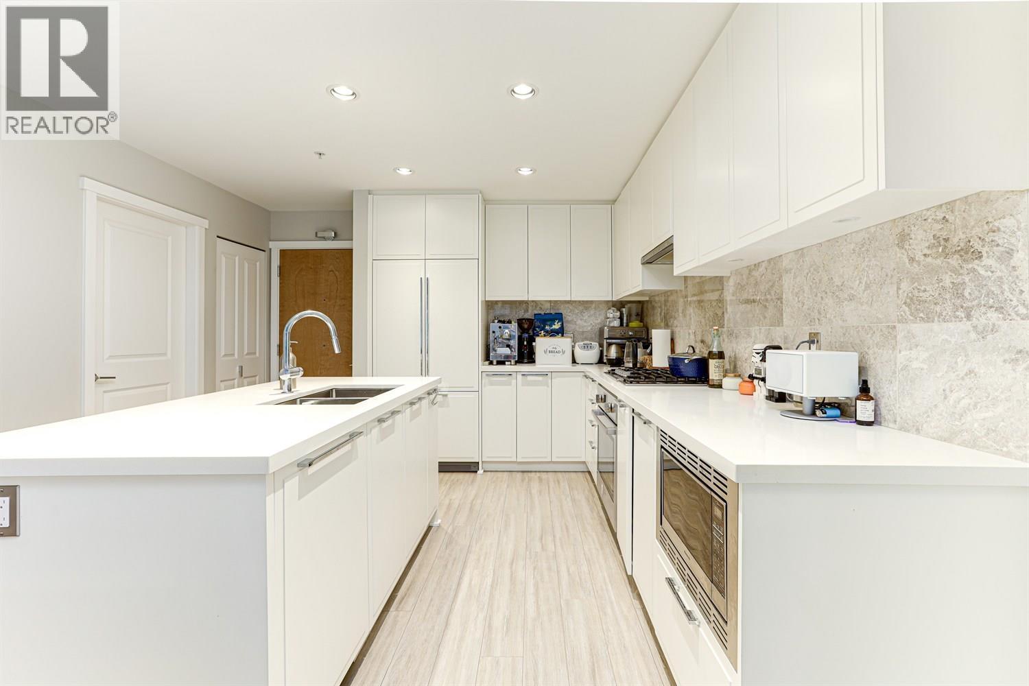 108 3188 Riverwalk Avenue, Vancouver, BC - Indoor Photo Showing Kitchen With Double Sink