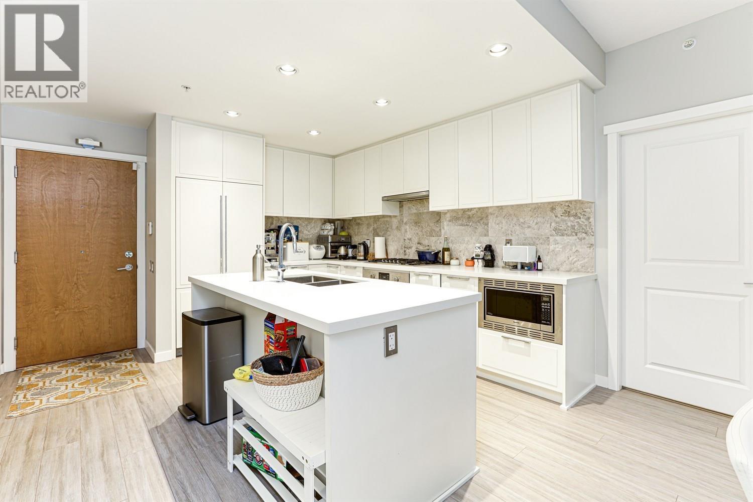 108 3188 Riverwalk Avenue, Vancouver, BC - Indoor Photo Showing Kitchen With Double Sink