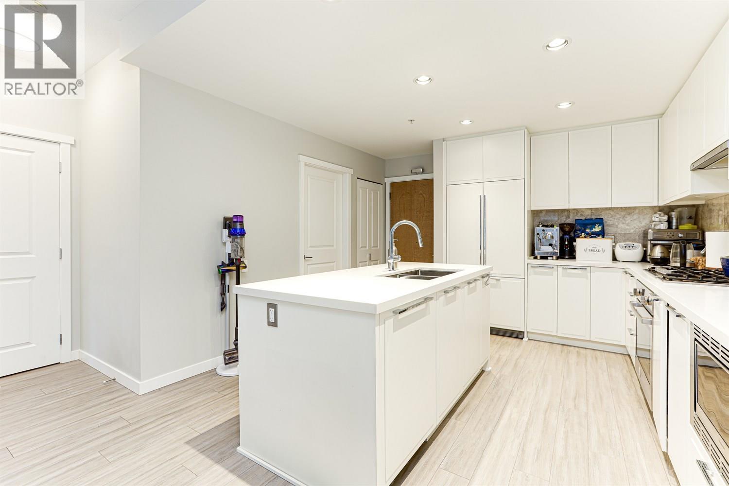 108 3188 Riverwalk Avenue, Vancouver, BC - Indoor Photo Showing Kitchen With Double Sink