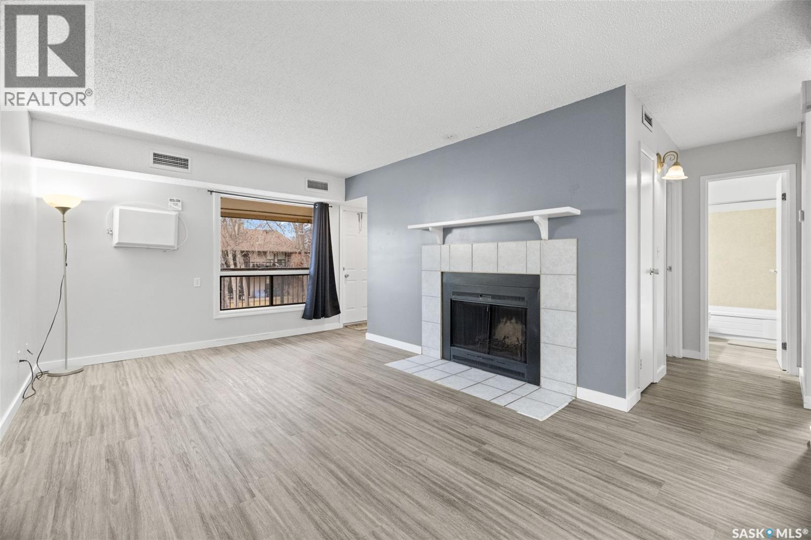70 Gore Place, Regina, SK - Indoor Photo Showing Living Room With Fireplace
