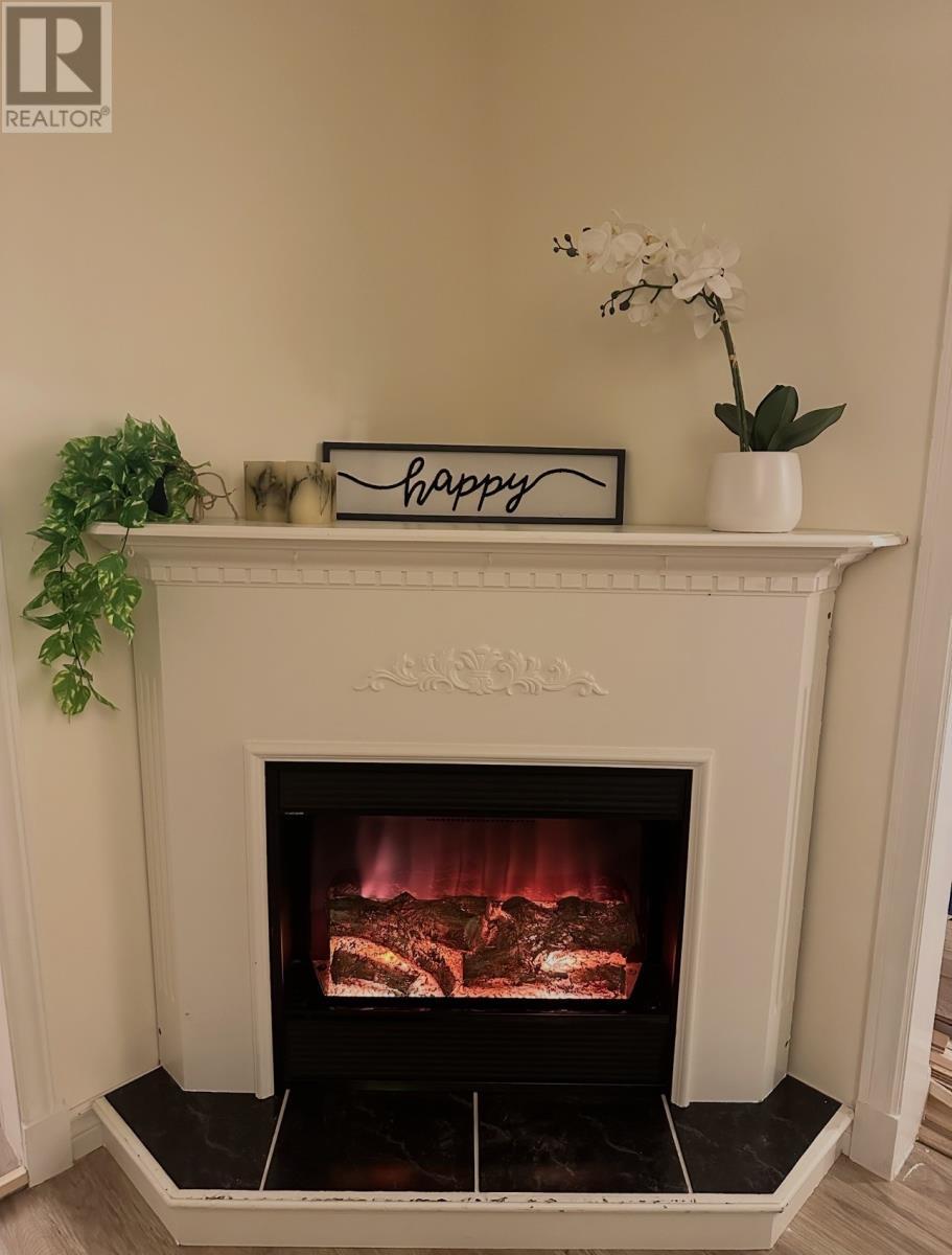 52 Fifth Street, Wabana, NL - Indoor Photo Showing Living Room With Fireplace