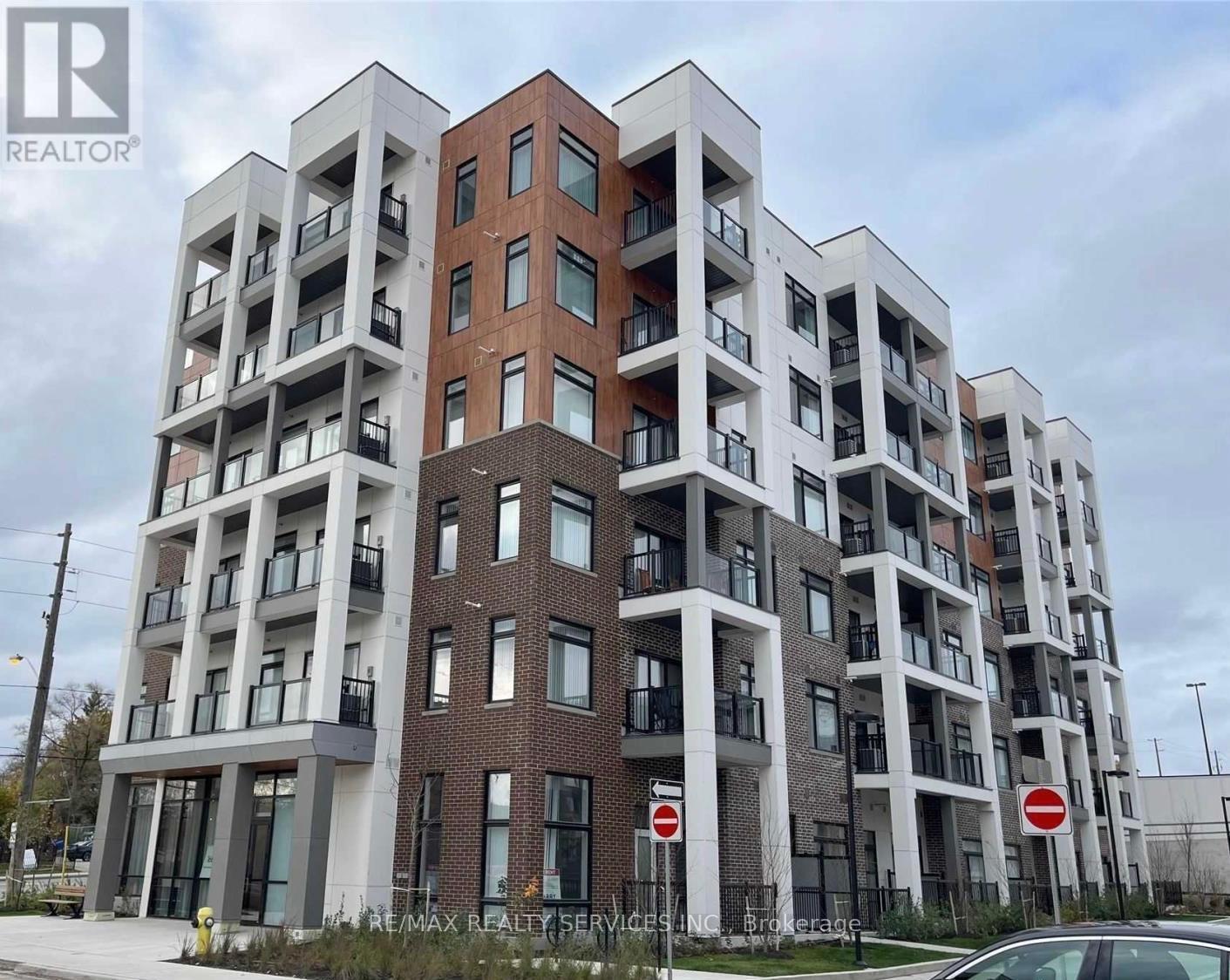 301 - 160 Canon Jackson Drive, Toronto, ON - Outdoor With Balcony With Facade