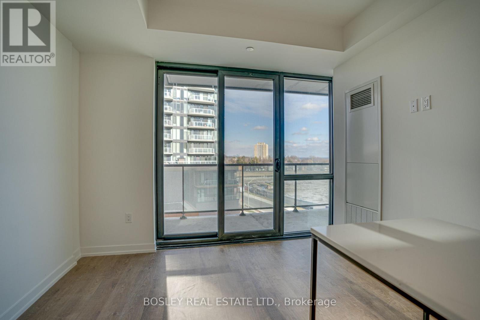 clear views of the water and Toronto - 414 - 251 Masonry Way, Mississauga, ON - Indoor Photo Showing Other Room