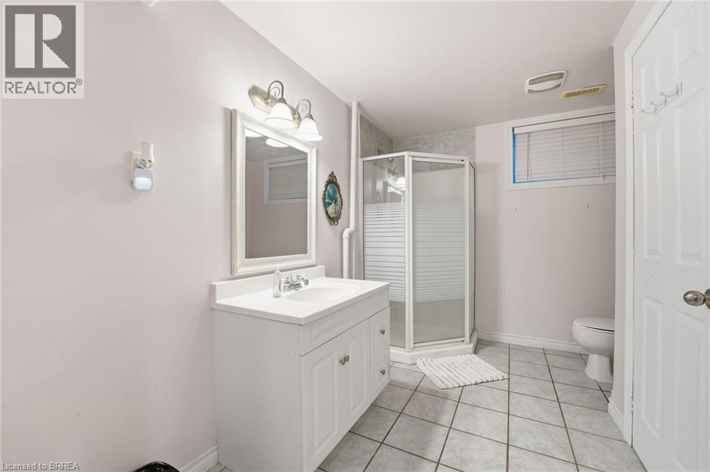Full bathroom with vanity, light tile patterned floors, and a shower stall - 14 Dunton Lane, Paris, ON - Indoor Photo Showing Bathroom