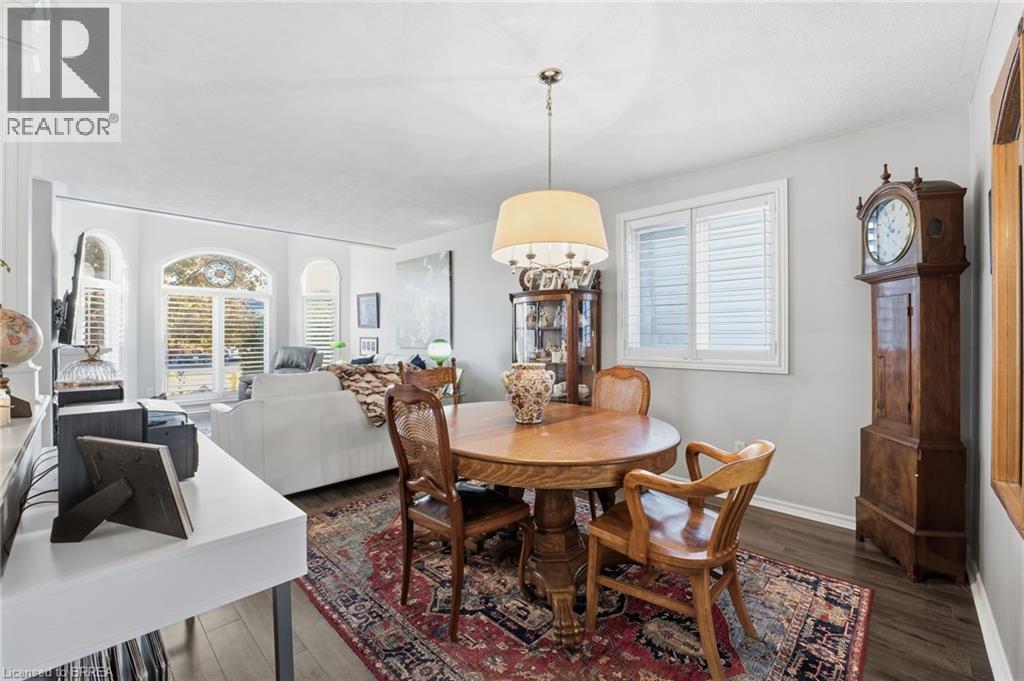 Dining space with plenty of natural light and dark wood-style floors - 14 Dunton Lane, Paris, ON - Indoor Photo Showing Dining Room