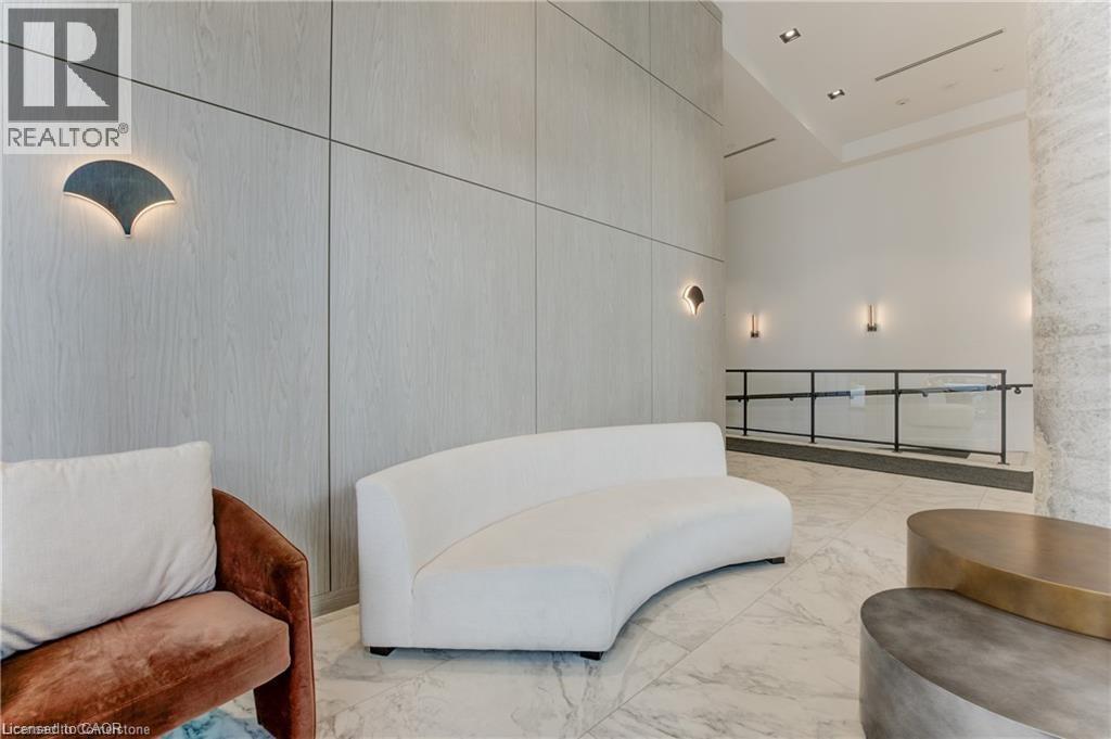 Living area with a towering ceiling - 5 Wellington Street S Unit# 703, Kitchener, ON - Indoor Photo Showing Other Room