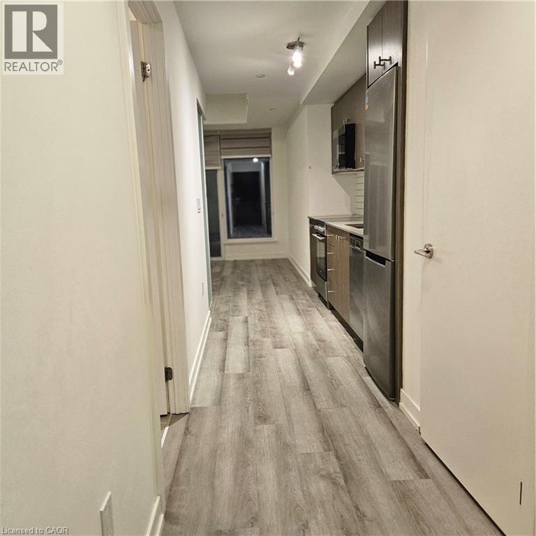 Hall featuring light wood-type flooring - 5 Wellington Street S Unit# 703, Kitchener, ON - Indoor