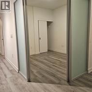 Hall featuring wood-type flooring -