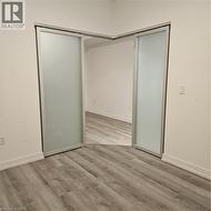 Unfurnished bedroom featuring light hardwood / wood-style floors and a closet -