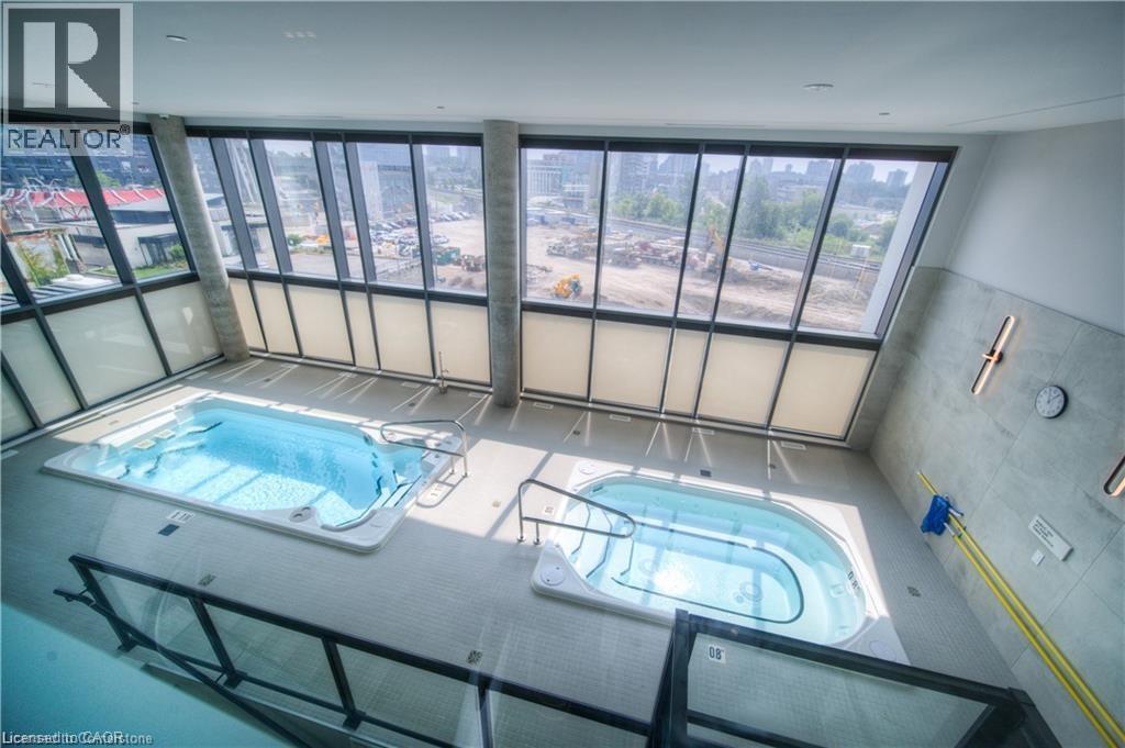 View of pool featuring an indoor in ground hot tub - 5 Wellington Street S Unit# 703, Kitchener, ON - Indoor Photo Showing Other Room