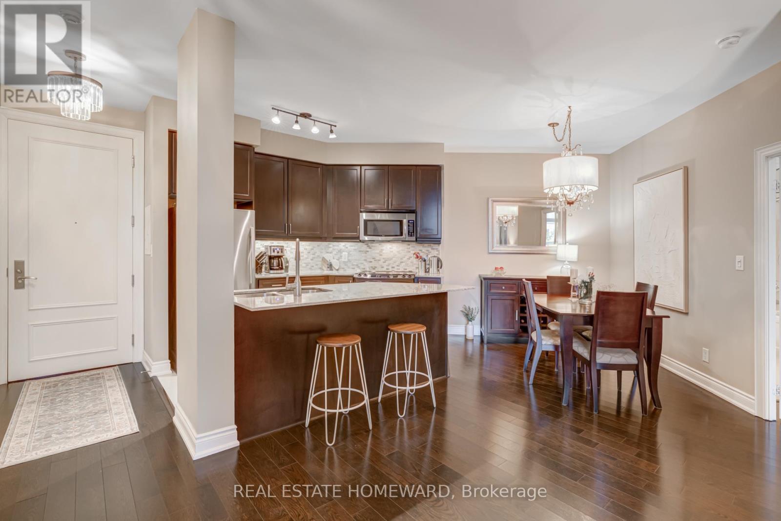 It has a proper dining space for family dinners. - 206 - 10 Bloorview Place, Toronto, ON - Indoor