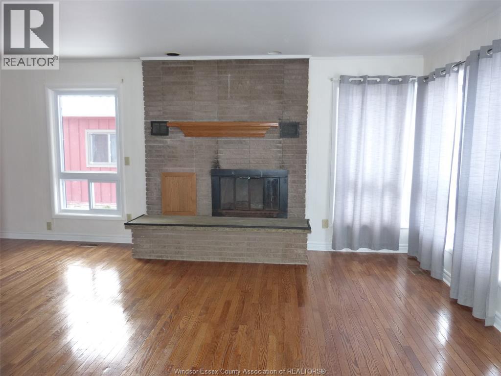 2410 Fox Run, Leamington, ON - Indoor Photo Showing Living Room With Fireplace