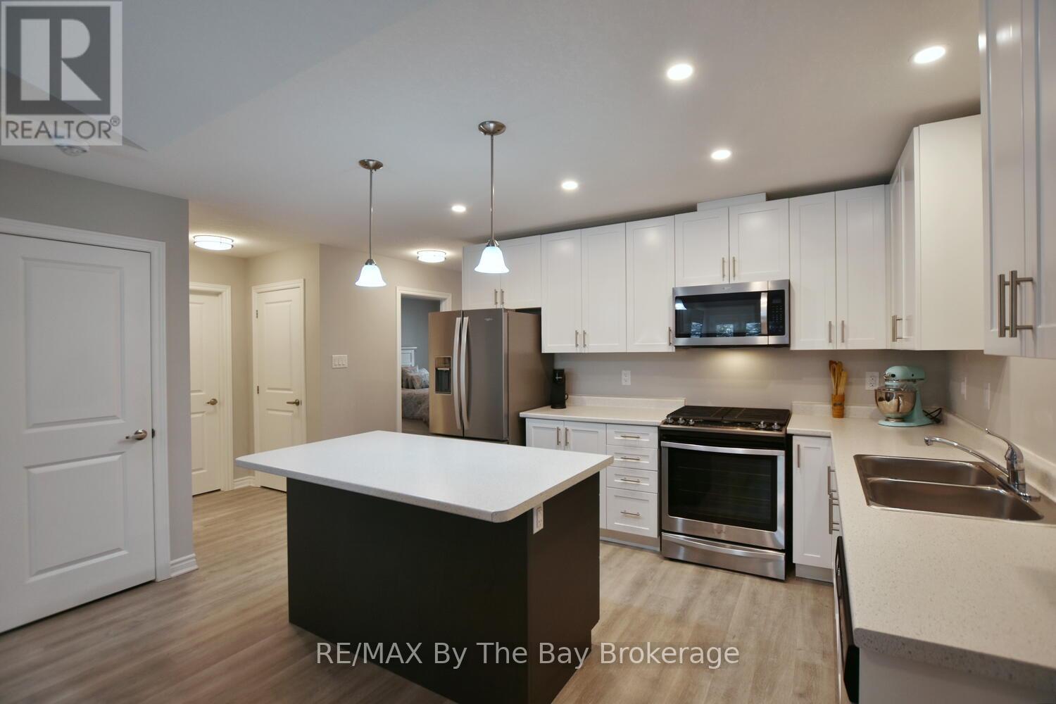 Kitchen with Open Concept Convinence - 30 Ivy Crescent, Wasaga Beach, ON - Indoor Photo Showing Kitchen With Stainless Steel Kitchen With Double Sink With Upgraded Kitchen