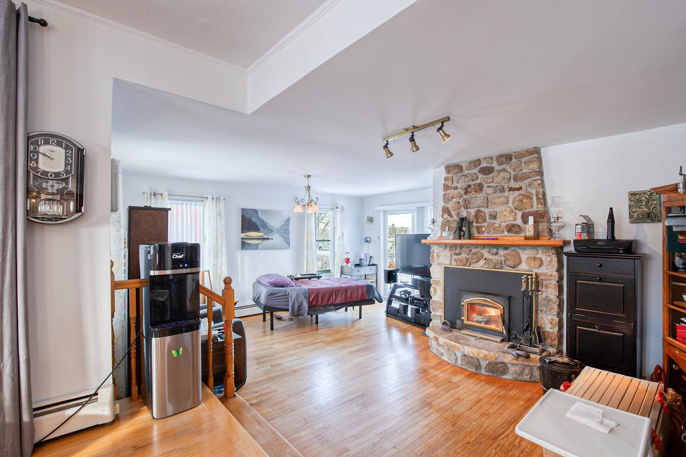 Living room - 467 Route 133, Pike River, QC - Indoor Photo Showing Living Room With Fireplace
