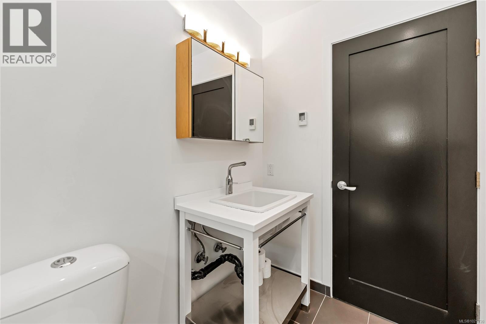 2-pc bathroom on lower level - 5198 Beckton Rd, Saanich, BC - Indoor Photo Showing Laundry Room
