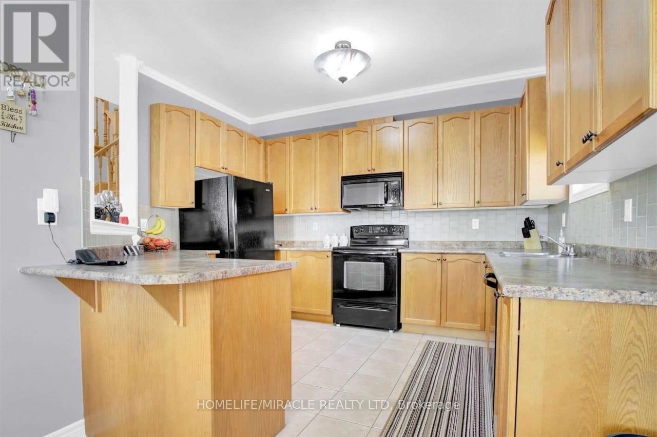 Upper - 51 Connolly Crescent, Brampton, ON - Indoor Photo Showing Kitchen With Double Sink