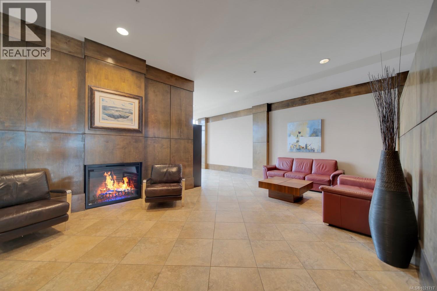 Building lobby. - 110 38 Front St, Nanaimo, BC - Indoor With Fireplace