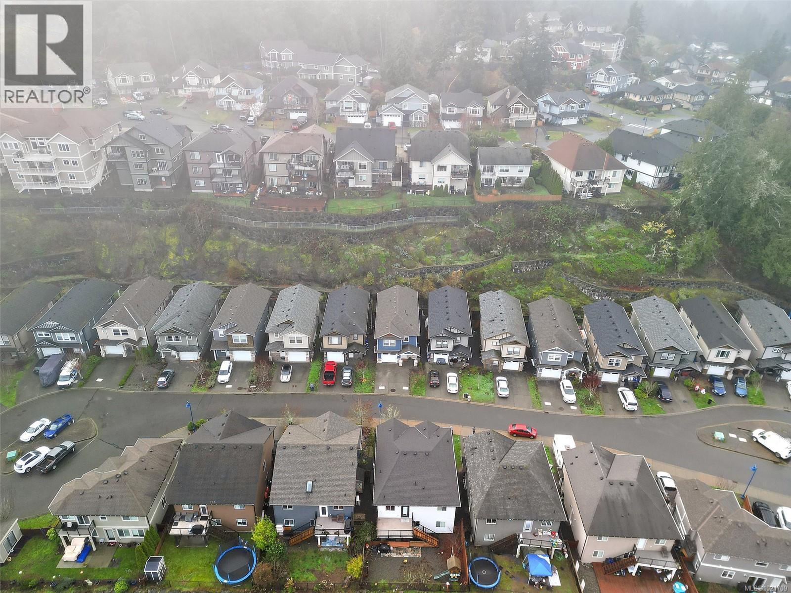 Aerial view of property's location with nearby suburban area - 883 Wild Ridge Way, Langford, BC -