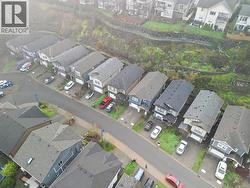 Aerial view of property's location with nearby suburban area -