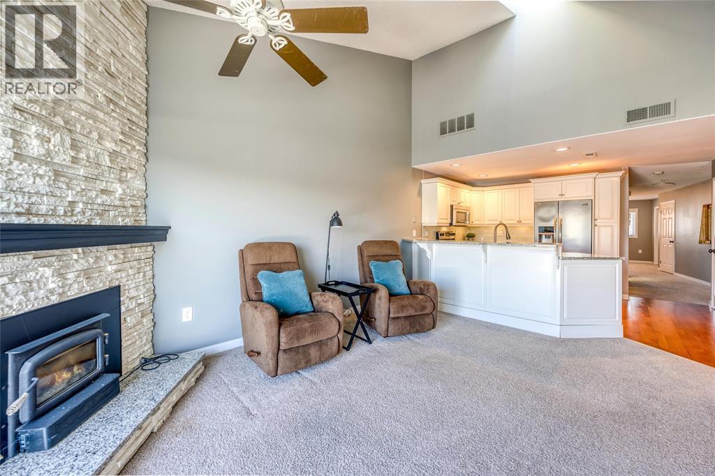 1500 Venetian Boulevard Unit# W-29, Point Edward, ON - Indoor Photo Showing Living Room With Fireplace