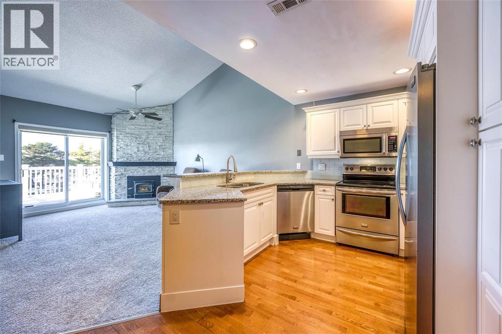 1500 Venetian Boulevard Unit# W-29, Point Edward, ON - Indoor Photo Showing Kitchen With Fireplace