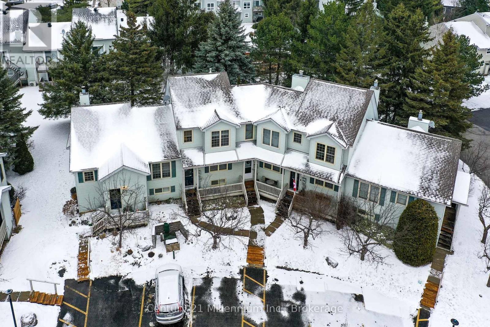 Designated Parking Spot #124 & Visitor Parking - 124 - 150 Victoria Street S, Blue Mountains, ON - Outdoor With Deck Patio Veranda