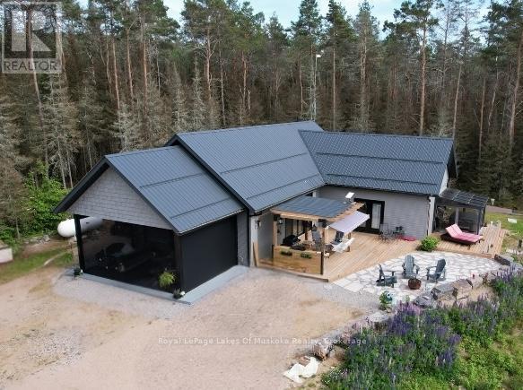 Welcome to Luxury Living in an Unorganized Twnsp! - 679 Boulder Road, South River, ON - Outdoor With Deck Patio Veranda