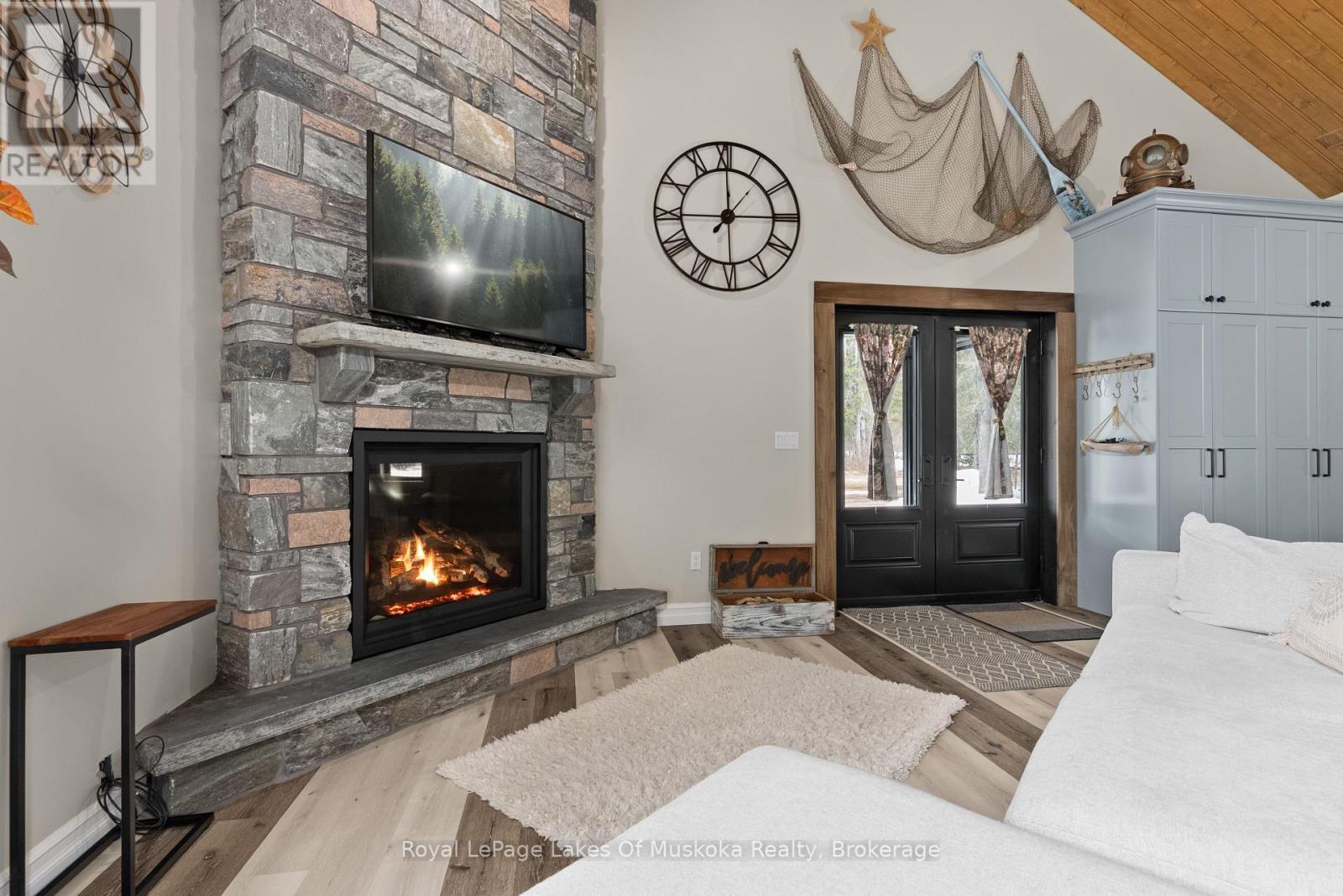 679 Boulder Road, South River, ON - Indoor Photo Showing Living Room With Fireplace
