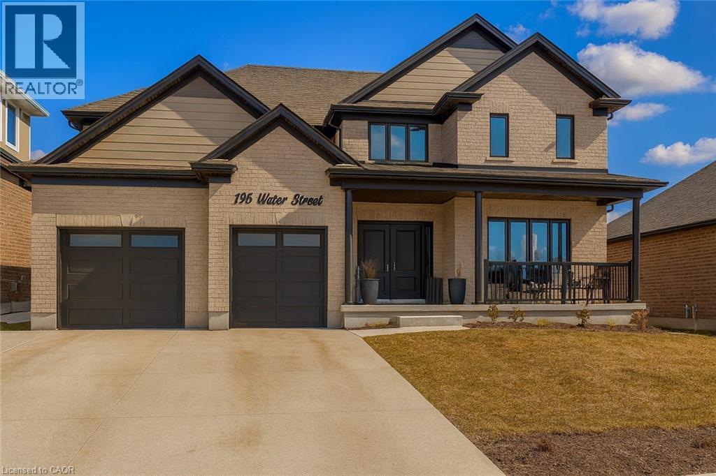 Craftsman house with brick siding, covered porch, driveway, and a front lawn - 195 Water Street, St. Jacobs, ON - Outdoor With Deck Patio Veranda