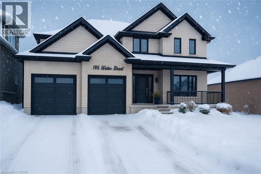 View of front of property featuring covered porch and an attached garage - 195 Water Street, St. Jacobs, ON - Outdoor With Facade