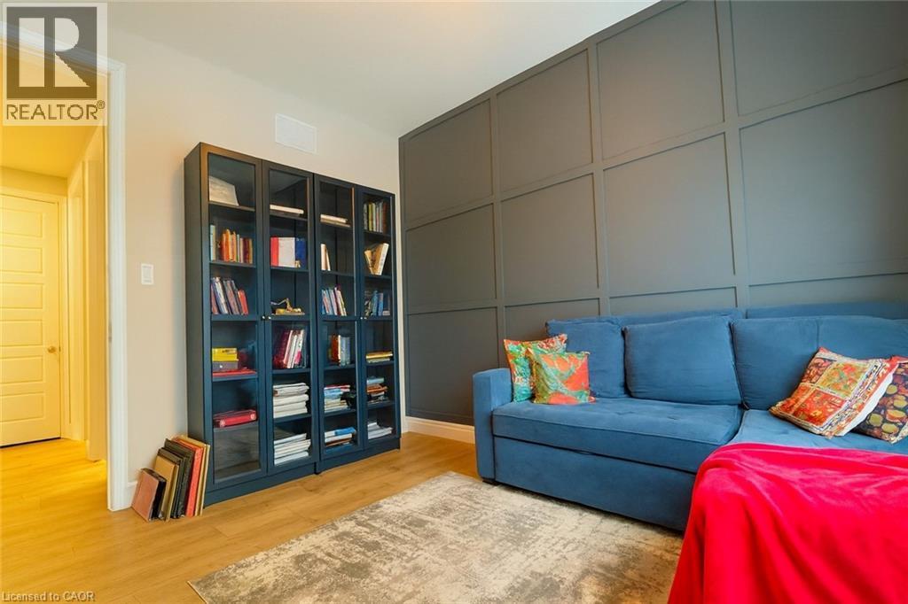 Sitting room featuring a decorative wall and light wood finished floors - 195 Water Street, St. Jacobs, ON - Indoor