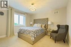 Carpeted bedroom with baseboards -