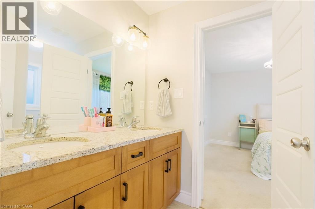 Ensuite bathroom with double vanity and light colored carpet - 195 Water Street, St. Jacobs, ON - Indoor Photo Showing Bathroom