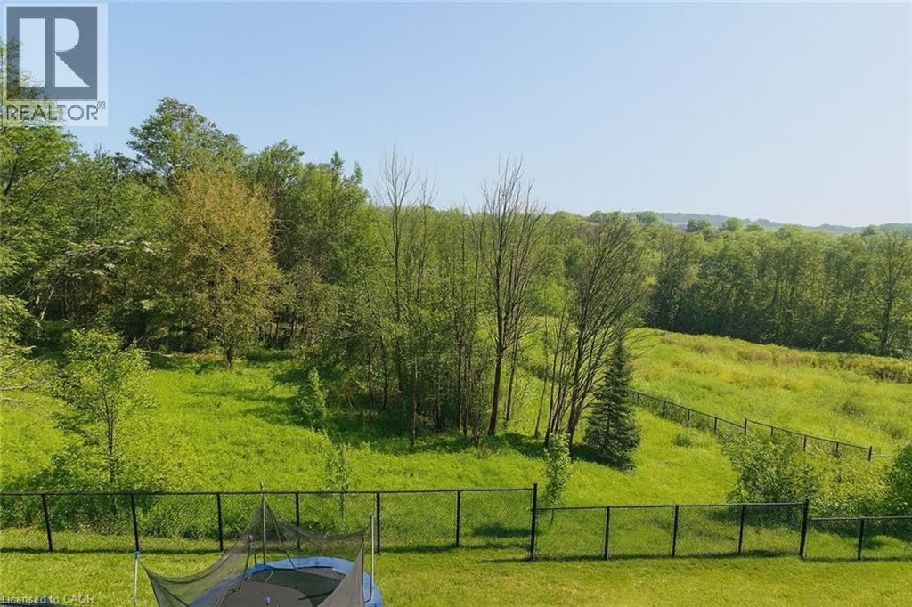 View of yard featuring a forest view - 195 Water Street, St. Jacobs, ON - Outdoor With View