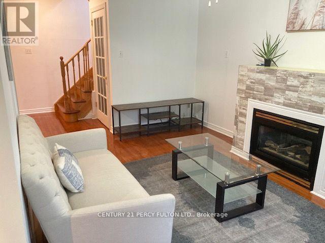 27 Whitewater Street, Whitby, ON - Indoor Photo Showing Living Room With Fireplace
