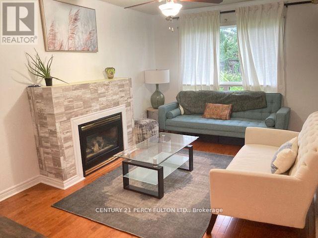 27 Whitewater Street, Whitby, ON - Indoor Photo Showing Living Room With Fireplace