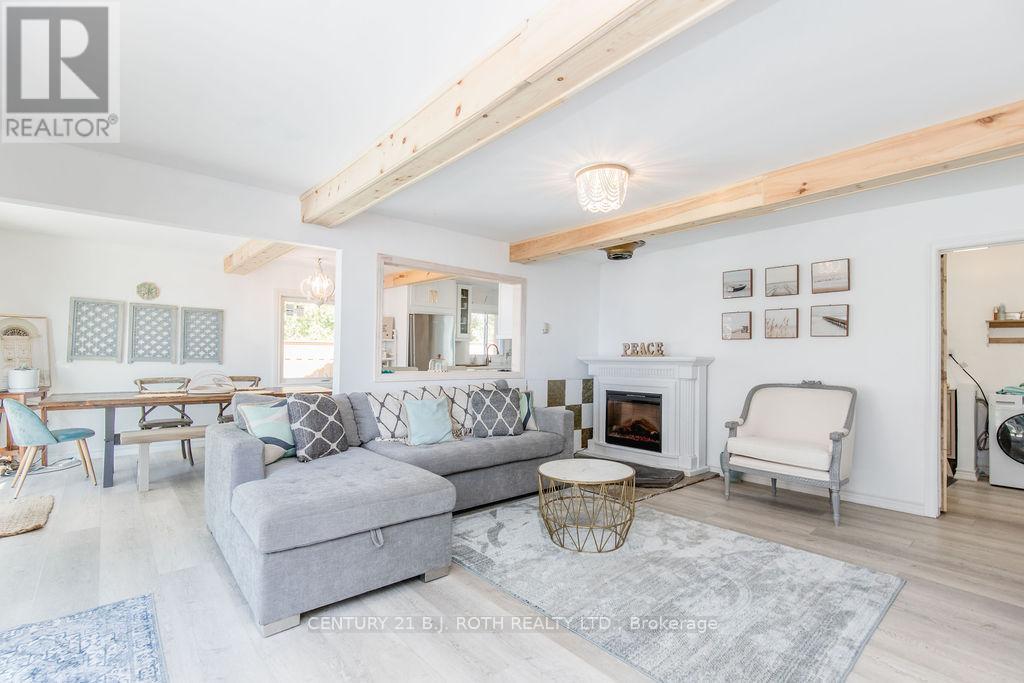 7 Oliver Drive, Tiny, ON - Indoor Photo Showing Living Room With Fireplace