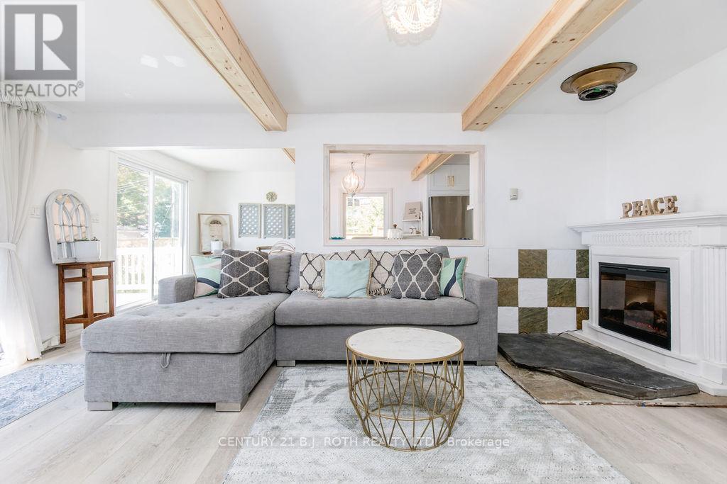 7 Oliver Drive, Tiny, ON - Indoor Photo Showing Living Room With Fireplace