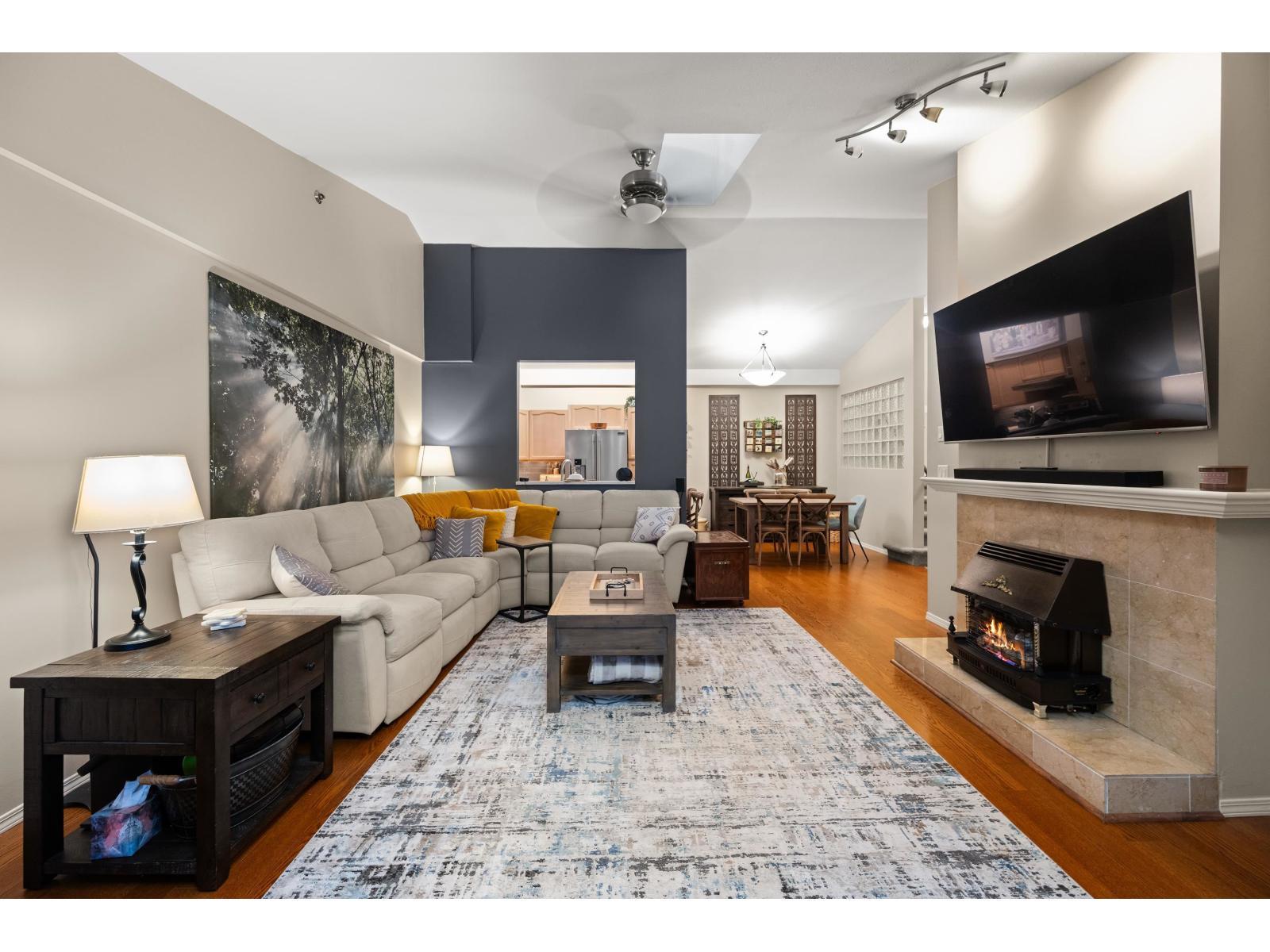 402 19721 64 Avenue, Langley, BC - Indoor Photo Showing Living Room With Fireplace