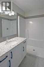 ensuite bath, quartz vanity, tile floor - 105 Cobbestone Gate Sw, Airdrie, AB - Indoor