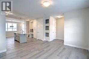 9ft ceilings, hardwood floor througout main floor - 105 Cobbestone Gate Sw, Airdrie, AB - Indoor Photo Showing Other Room
