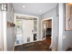 inside the front entrance - office with french doors just inside entry -