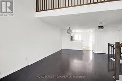 HDW floors in Living/Dining Rm on Upper Level. -