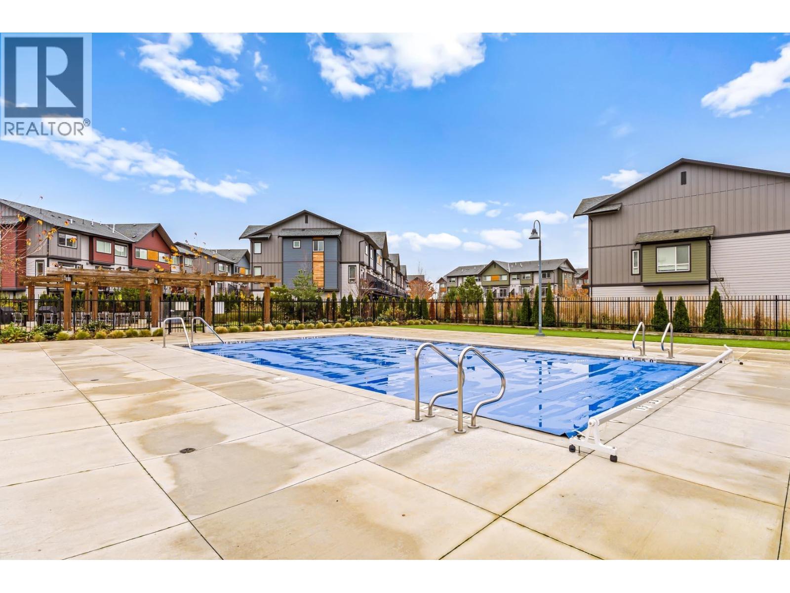 328 2499 Rabbit Drive, Tsawwassen, BC - Outdoor With In Ground Pool