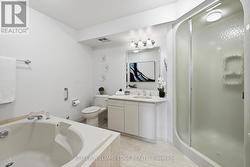 Primary Ensuite Soaker Tub & His/Hers vanities -