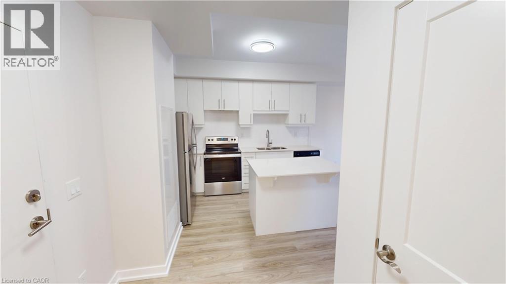 251 Northfield Drive E Unit# 410, Waterloo, ON - Indoor Photo Showing Kitchen With Double Sink