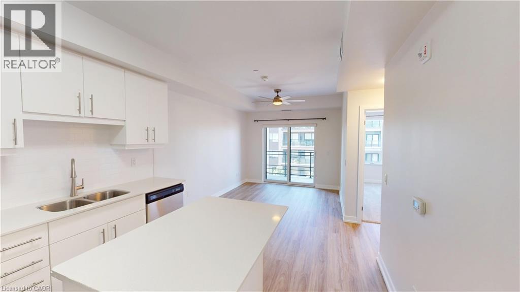 251 Northfield Drive E Unit# 410, Waterloo, ON - Indoor Photo Showing Kitchen With Double Sink With Upgraded Kitchen